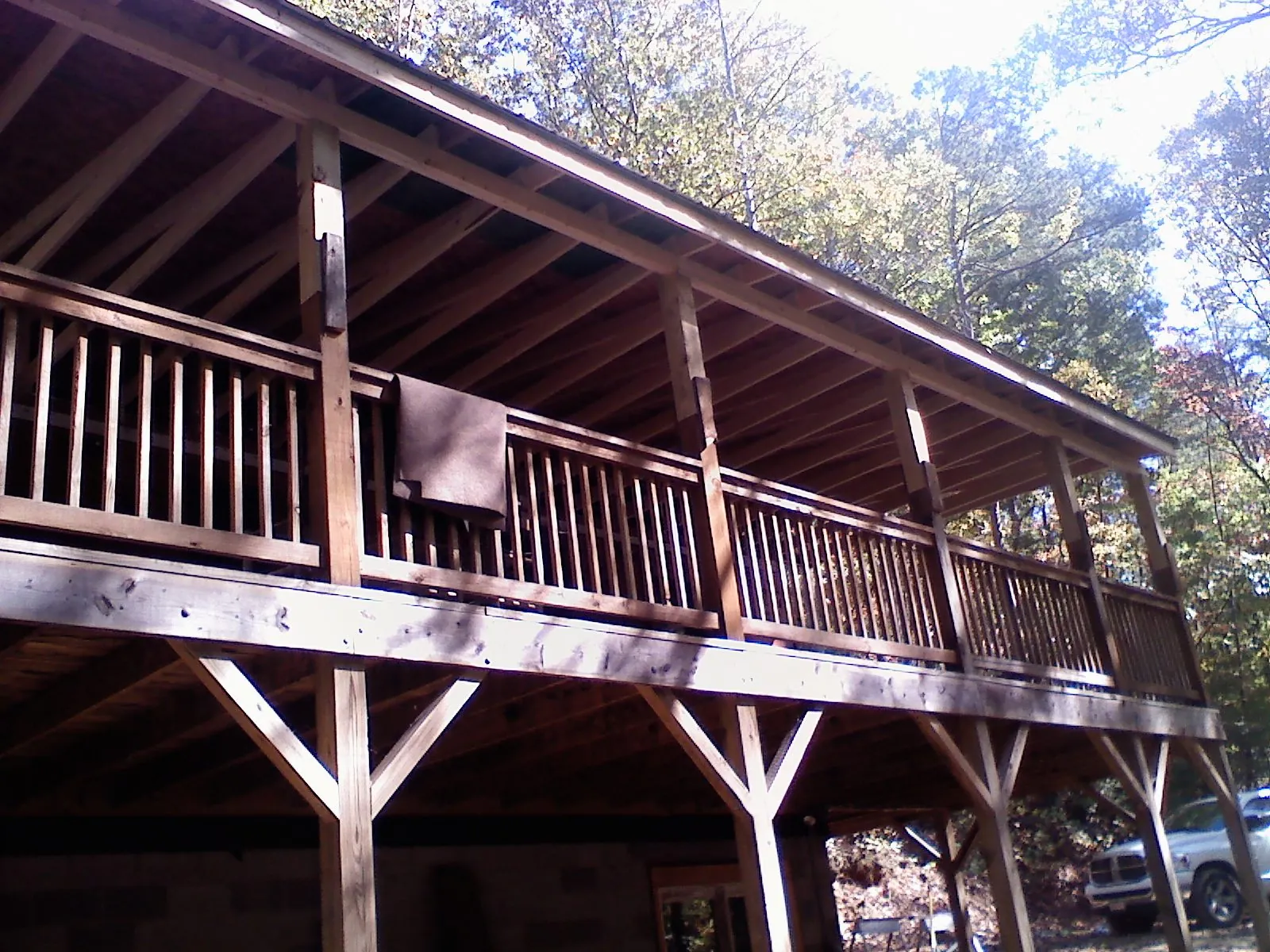 Timber framing under a new elevated porch and deck — Roof Leak Repair in Moretown by Roofing Brothers